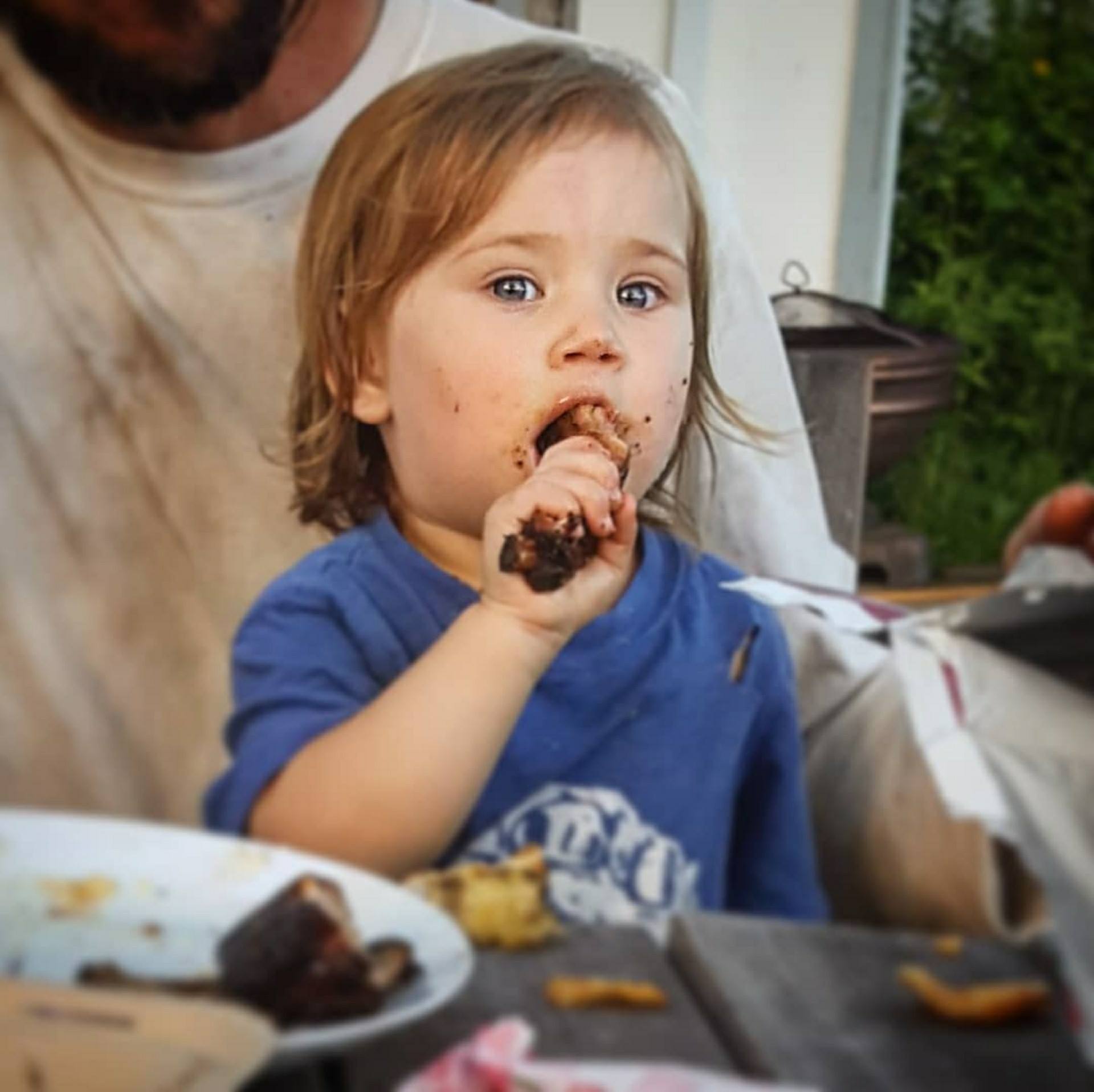 Kid enjoying ribs