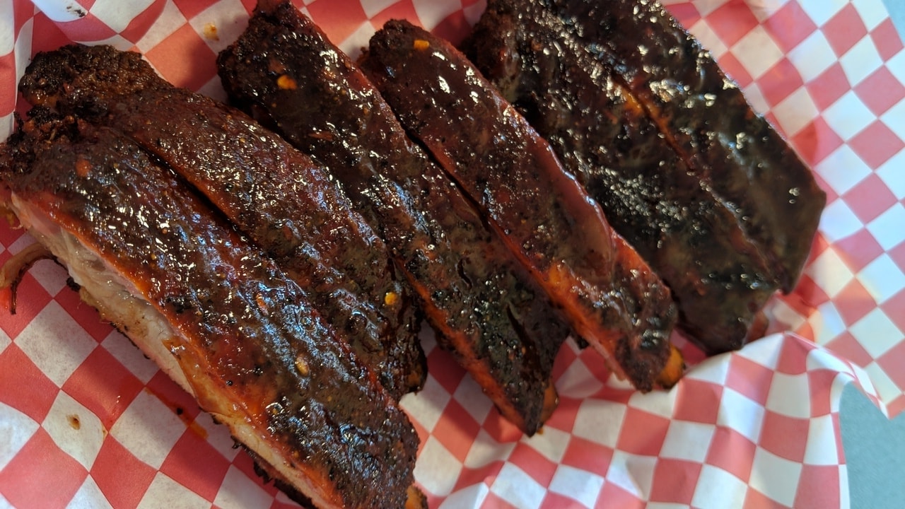 BBQ ribs on red checkered paper